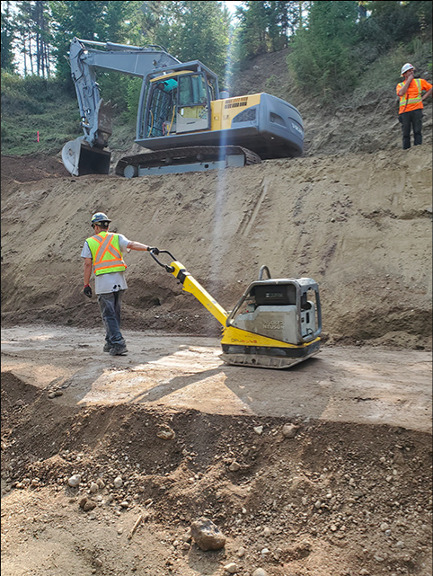 Excavator working on slope stabilization